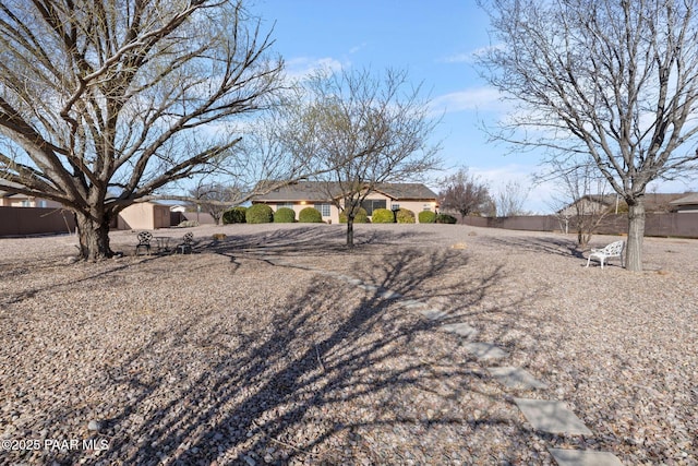 ranch-style house with fence