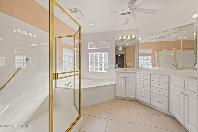 full bath with visible vents, a garden tub, a shower stall, tile patterned flooring, and double vanity