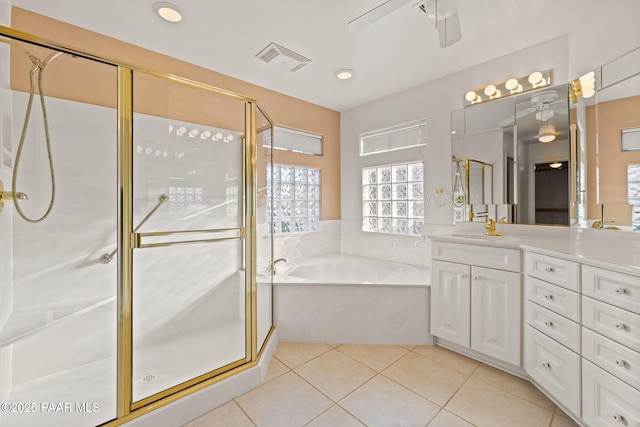 full bath with tile patterned floors, visible vents, a stall shower, and a garden tub