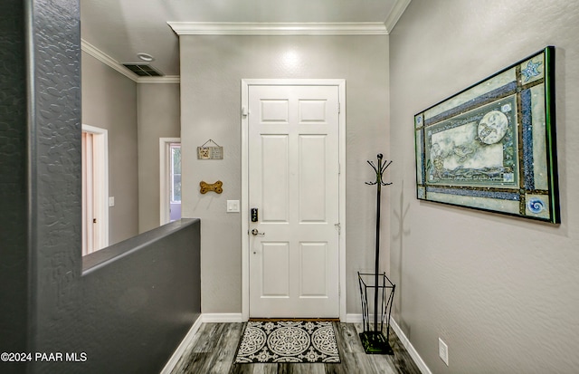 foyer featuring crown molding and hardwood / wood-style floors