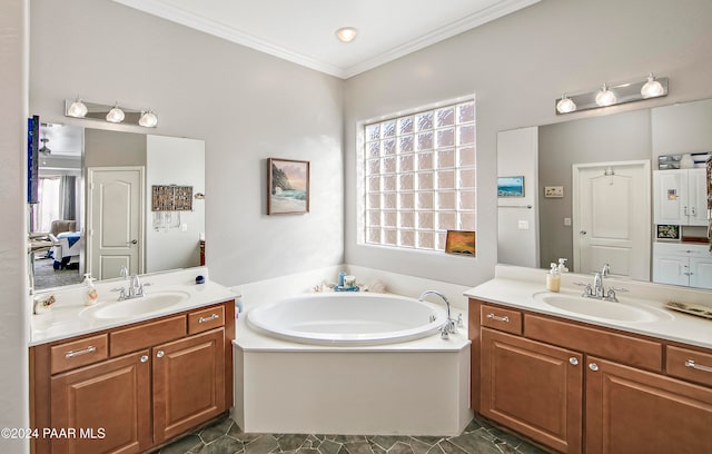 bathroom with a bathing tub, crown molding, and vanity