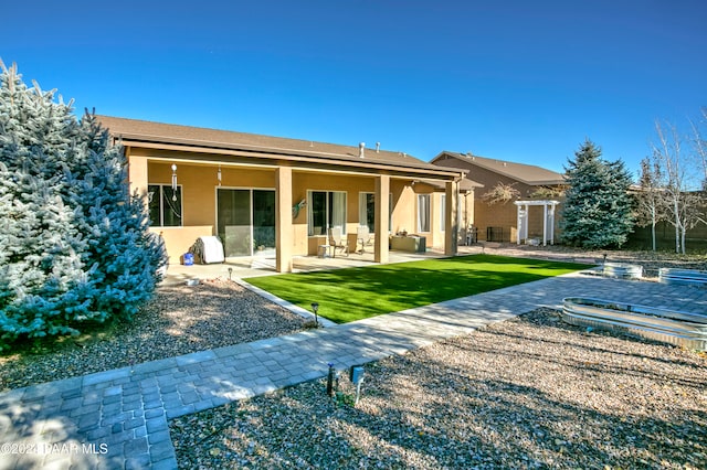 rear view of house featuring a patio