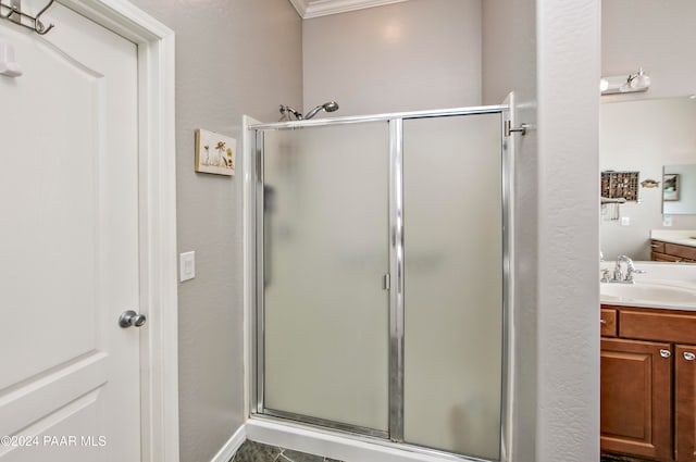 bathroom with vanity and walk in shower