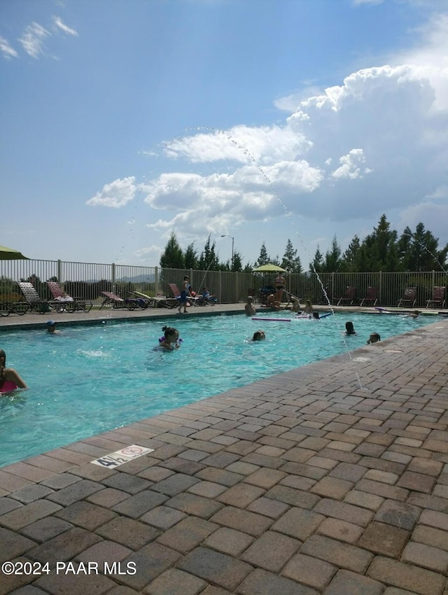 view of pool featuring pool water feature