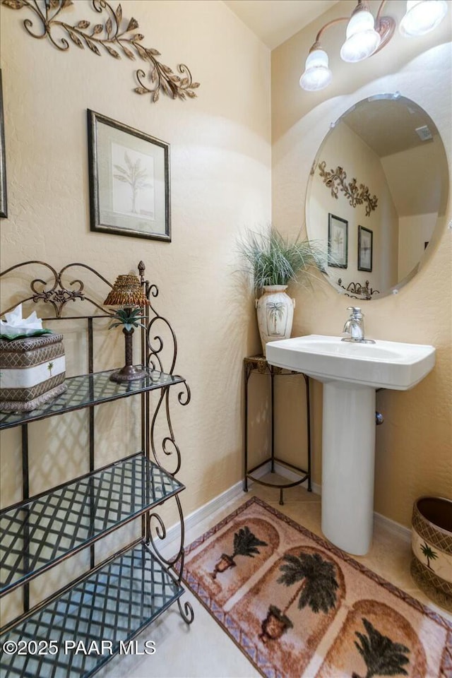 bathroom with tile patterned floors