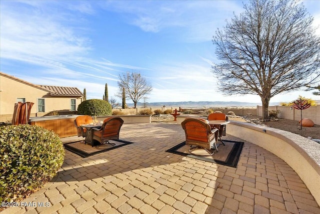 view of patio featuring a hot tub