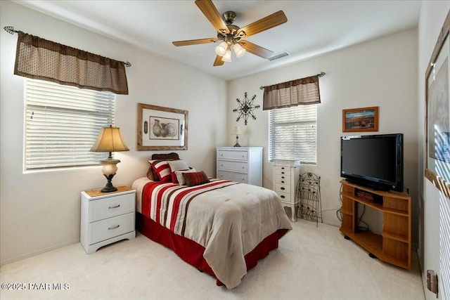 carpeted bedroom featuring ceiling fan