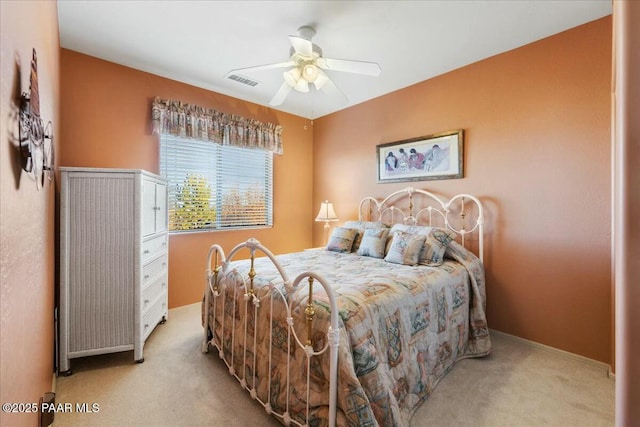 bedroom featuring light carpet and ceiling fan