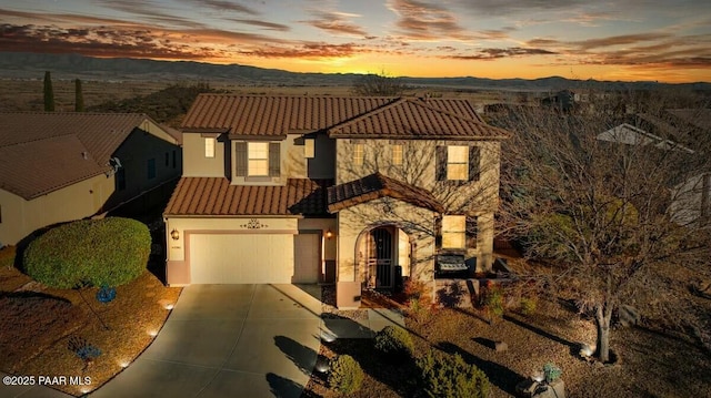 view of front of house with a mountain view and a garage