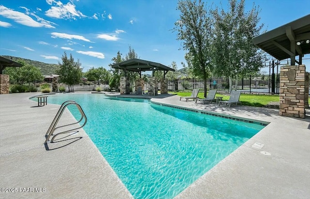 view of swimming pool with a patio area