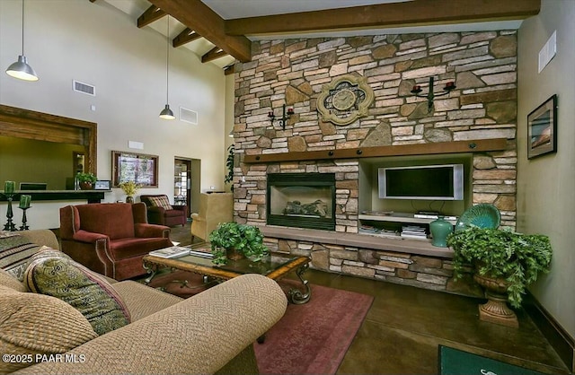 living room with beamed ceiling, a towering ceiling, and a fireplace