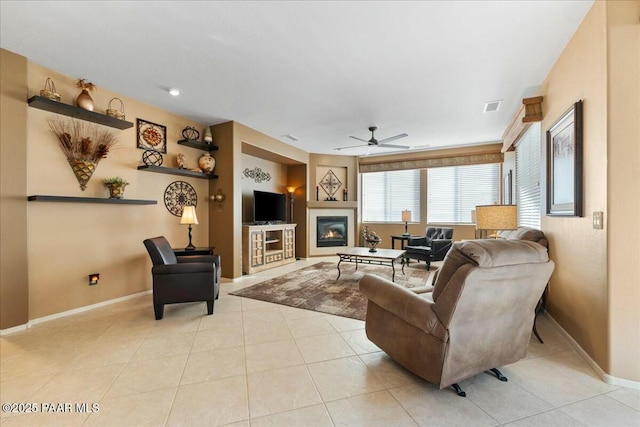 tiled living room featuring ceiling fan