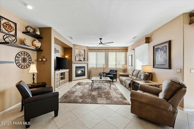 tiled living room with ceiling fan