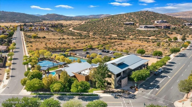 birds eye view of property featuring a mountain view