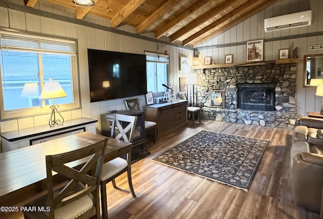 living room with hardwood / wood-style floors, wooden ceiling, an AC wall unit, vaulted ceiling with beams, and wooden walls