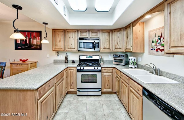 237 Creekside Cir Unit C, Prescott, AZ 86303 - kitchen with appliances with stainless steel finishes, a sink, a peninsula, light countertops, and decorative light fixtures