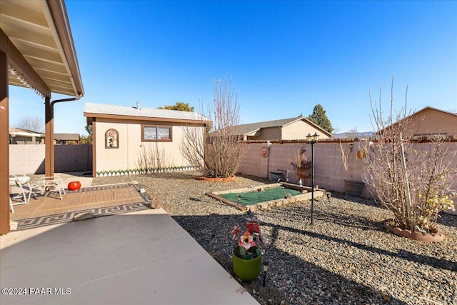 view of yard with a patio and an outdoor structure