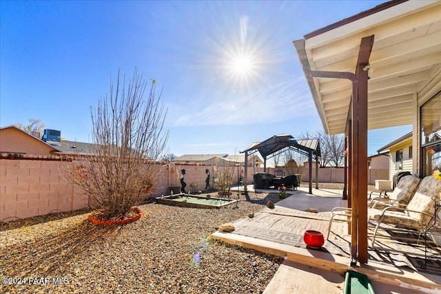 view of yard with central air condition unit and a patio