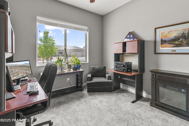 carpeted office space with baseboards