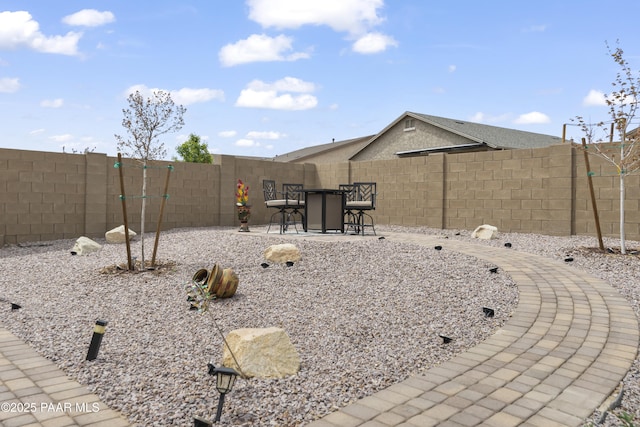 view of yard with a fenced backyard and a patio area