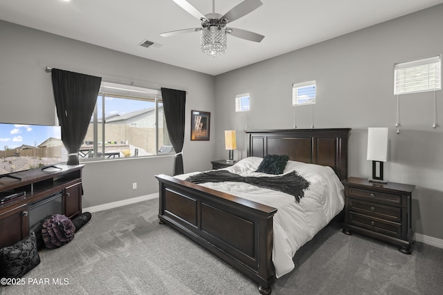 carpeted bedroom with baseboards, visible vents, and multiple windows