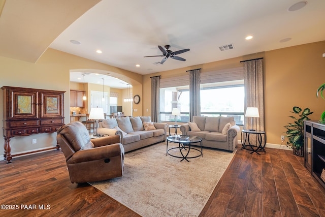1646 Constable St, Prescott, AZ 86301 - living area featuring dark wood-style floors, a ceiling fan, arched walkways, and recessed lighting