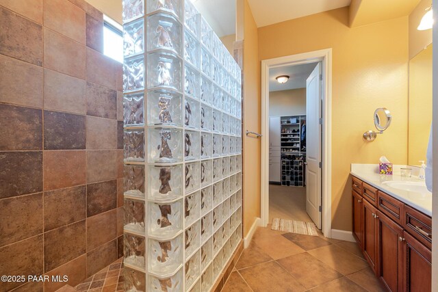 1646 Constable St, Prescott, AZ 86301 - bathroom with vanity, a walk in shower, tile patterned flooring, and a walk in closet