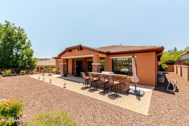 1646 Constable St, Prescott, AZ 86301 - back of property featuring stucco siding, a fenced backyard, a patio, and a tile roof