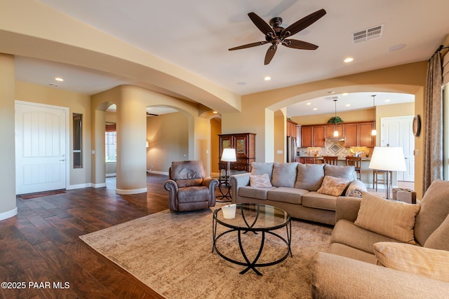 1646 Constable St, Prescott, AZ 86301 - living area with arched walkways, dark wood-style floors, ceiling fan, and recessed lighting