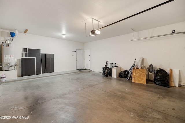 7070 E Lantern Ln, Prescott Valley, AZ 86314 - garage featuring gas water heater and a garage door opener