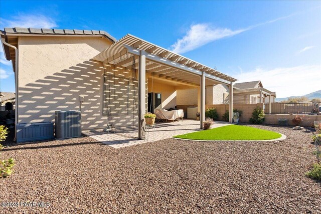 back of house featuring a pergola and a patio area