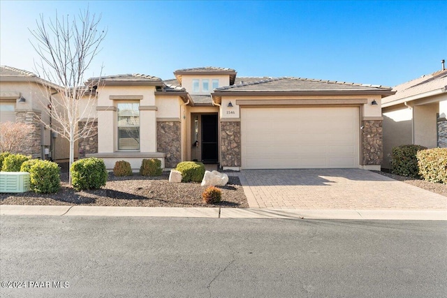 prairie-style home featuring a garage