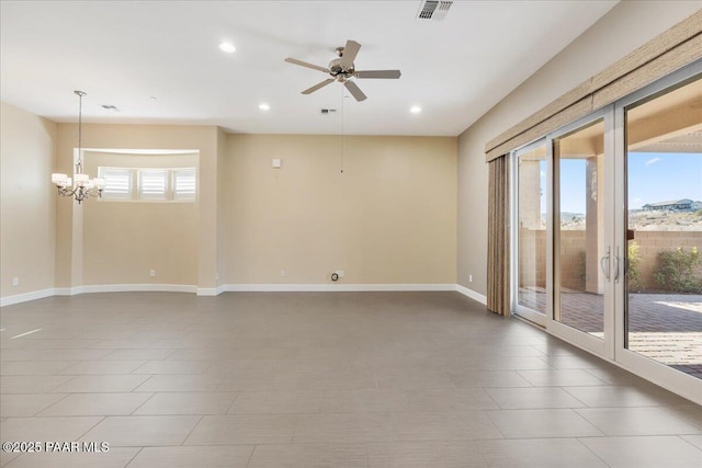 empty room with a healthy amount of sunlight and ceiling fan with notable chandelier