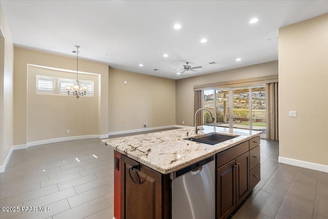 kitchen with a kitchen island with sink, sink, a wealth of natural light, and stainless steel dishwasher