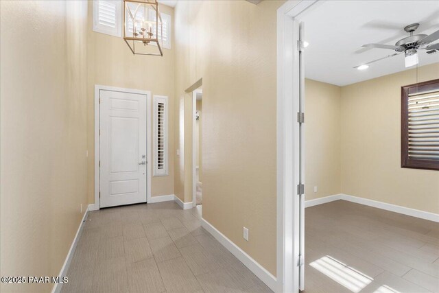 doorway featuring an inviting chandelier