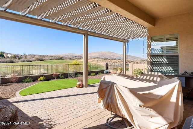 view of patio featuring a mountain view and a pergola