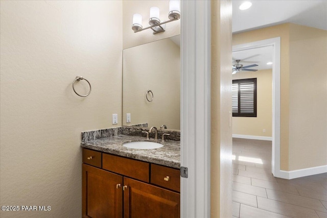 bathroom featuring ceiling fan, tile patterned floors, and vanity