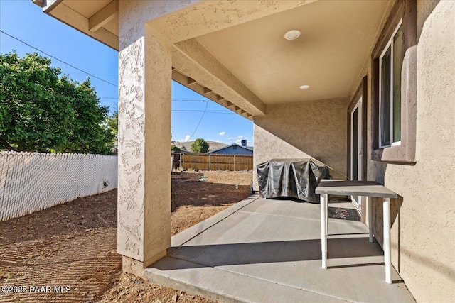 4956 E Ramada Dr, Prescott, AZ 86301 - fenced backyard with a grill and a patio area
