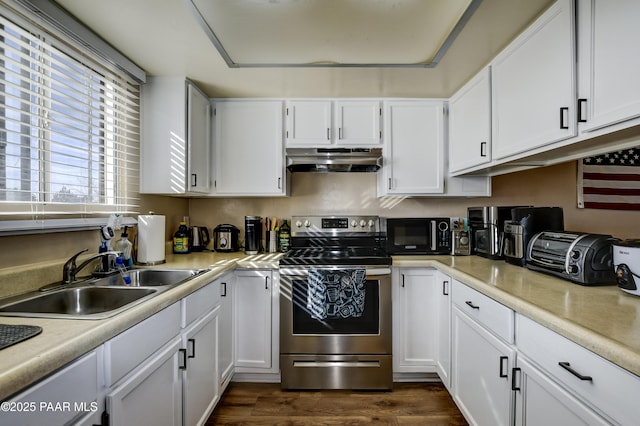 kitchen featuring sink, dark wood-type flooring, white cabinets, and stainless steel range with electric stovetop