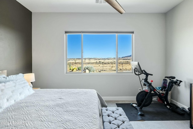 bedroom featuring ceiling fan and carpet