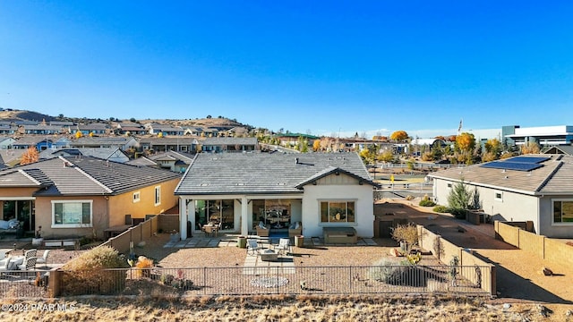 rear view of property featuring a patio