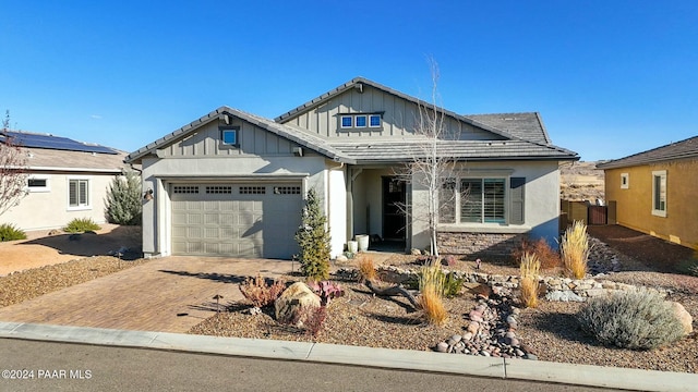 view of front of property featuring a garage