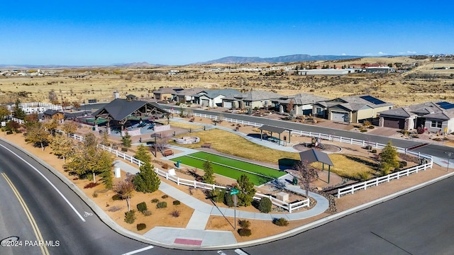 birds eye view of property with a mountain view