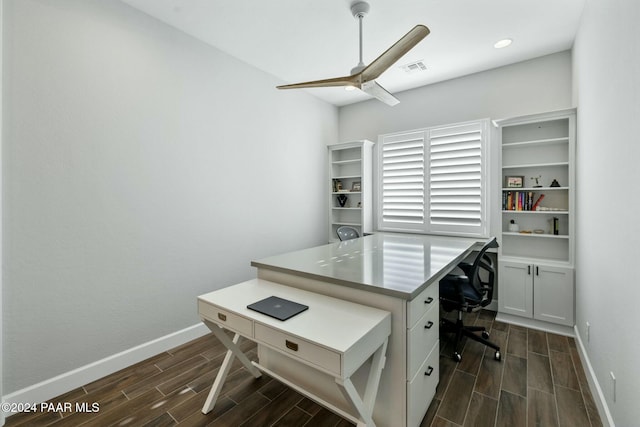 office space featuring dark hardwood / wood-style floors and ceiling fan