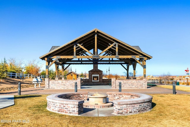 surrounding community with a gazebo and a yard