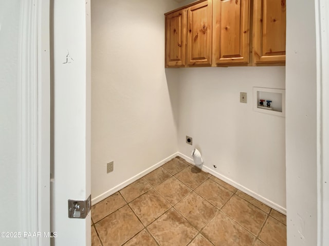 laundry room featuring washer hookup, light tile patterned floors, cabinet space, hookup for an electric dryer, and baseboards