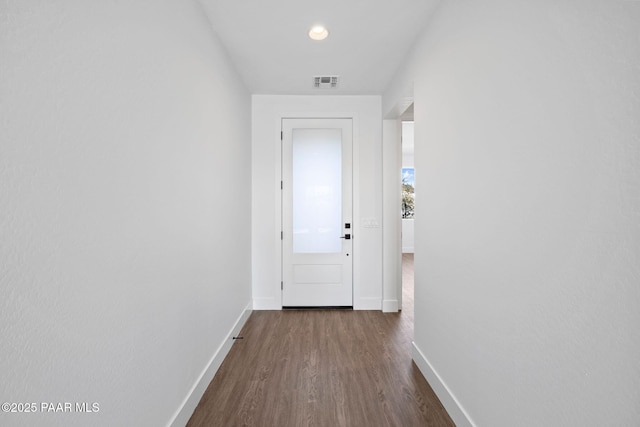 corridor with dark wood-type flooring