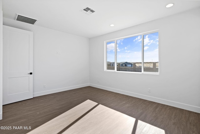 empty room featuring dark hardwood / wood-style floors