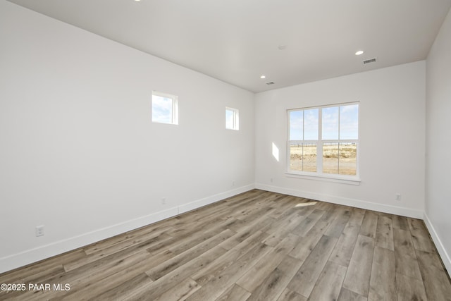 unfurnished room featuring light hardwood / wood-style flooring