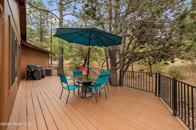 1210 Tanglewood Rd, Prescott, AZ 86303 - deck with outdoor dining space, area for grilling, and view of wooded area